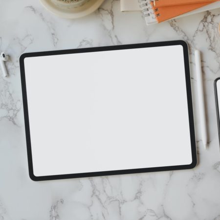 flat lay of black frame tablet